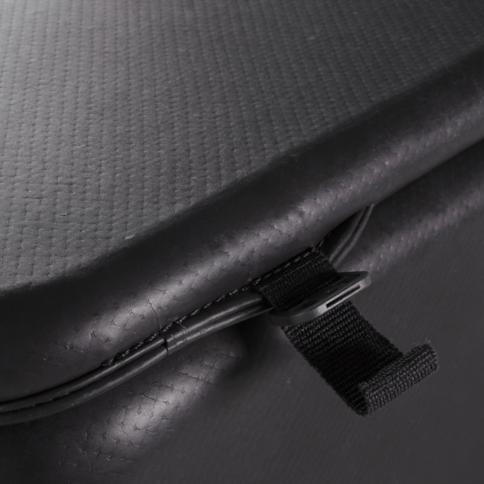 Close view of black PVC texture and securing strap